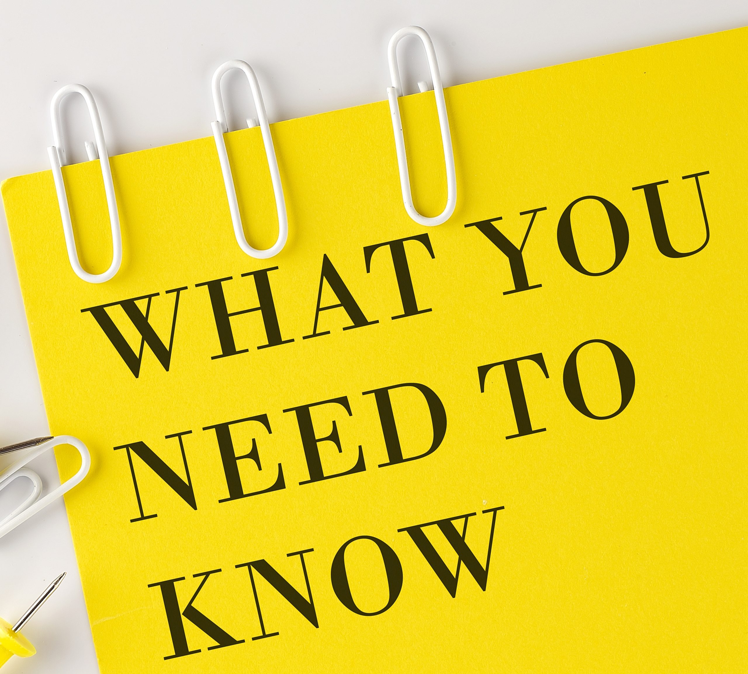 notepad with "what you need to know" text